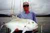 man with giant trevally